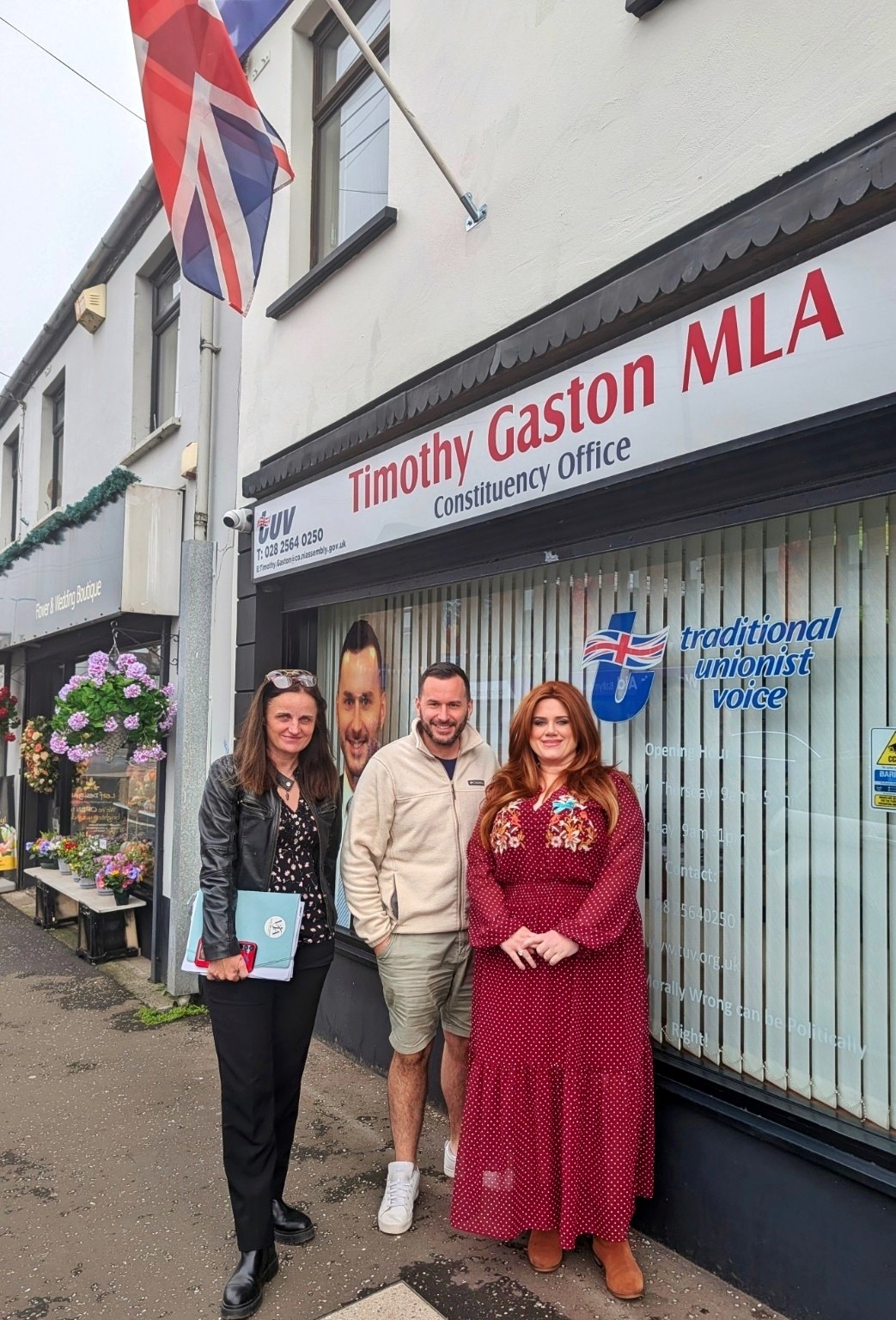 Voice and Justice Alliance representatives with Timothy Gaston MLA outside his constituency office